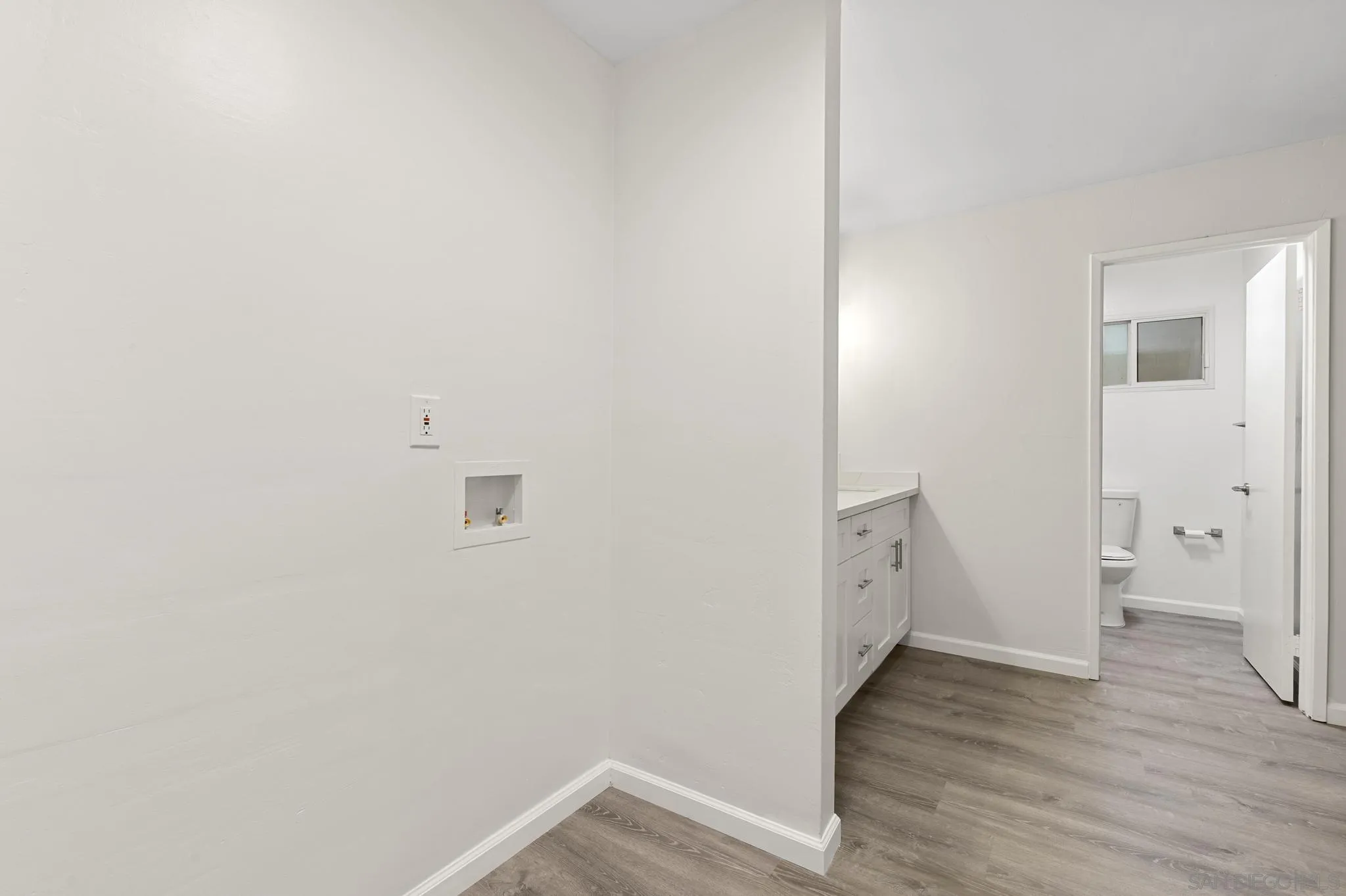 140 Walnut Avenue, Unit 2A San Diego, CA 92103 - Photo 12 of 22 a view of a room with wooden floor