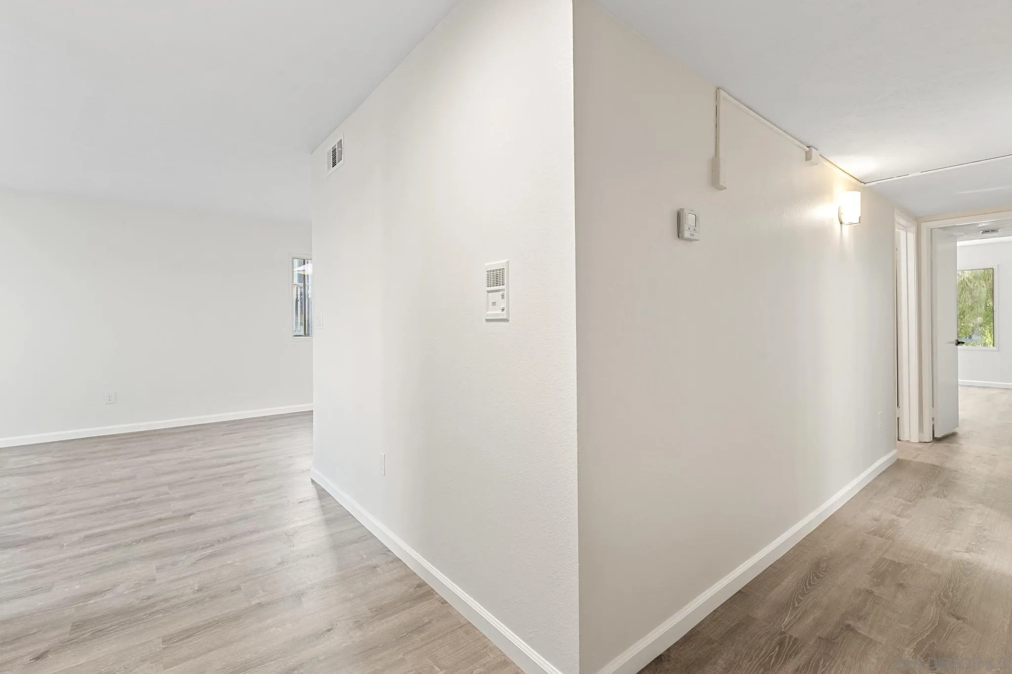 140 Walnut Avenue, Unit 2A San Diego, CA 92103 - Photo 16 of 22 a view of an empty room with wooden floor