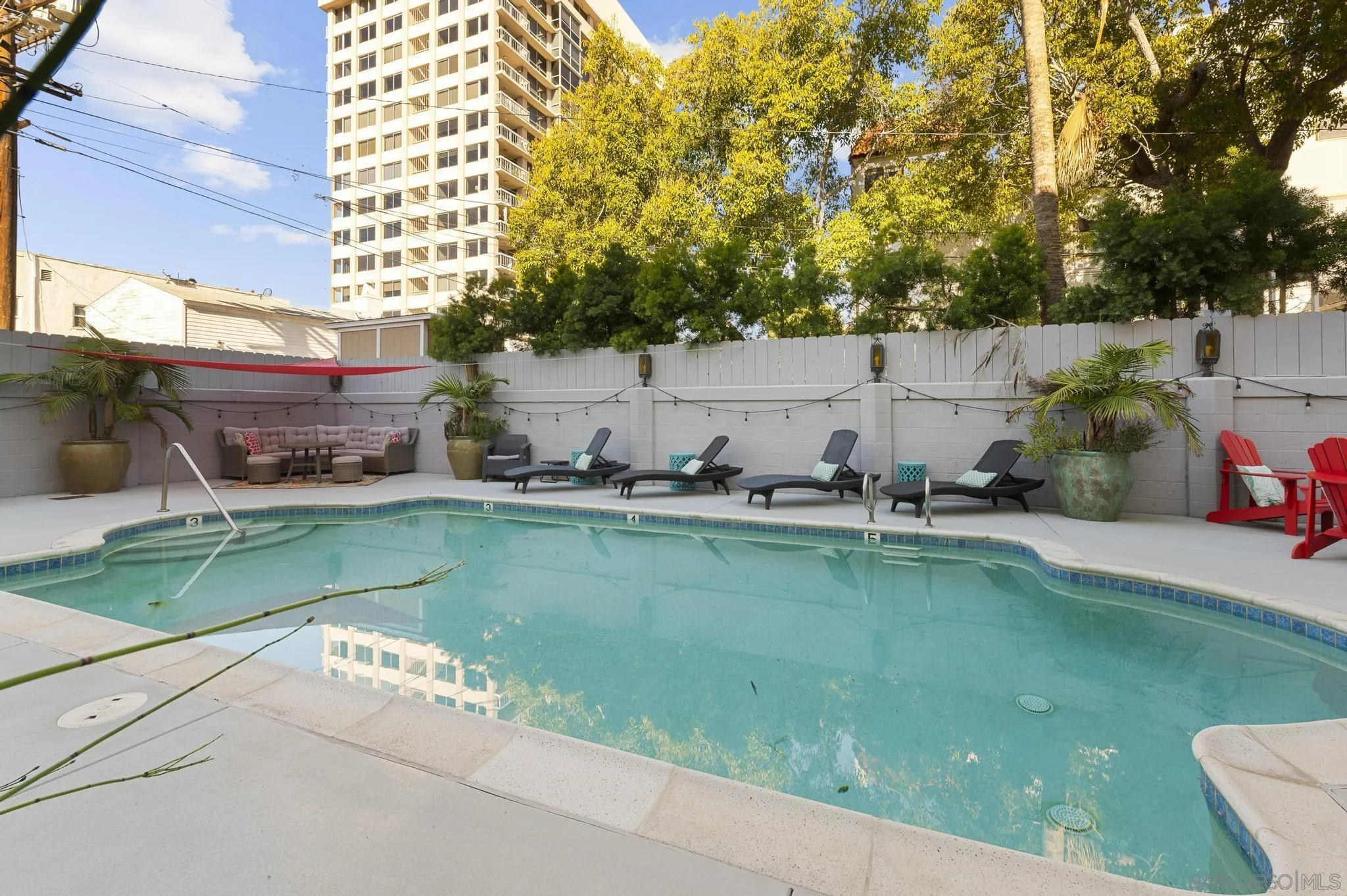 140 Walnut Avenue, Unit 2A San Diego, CA 92103 - Photo 18 of 22 a view of a swimming pool and lounge chair