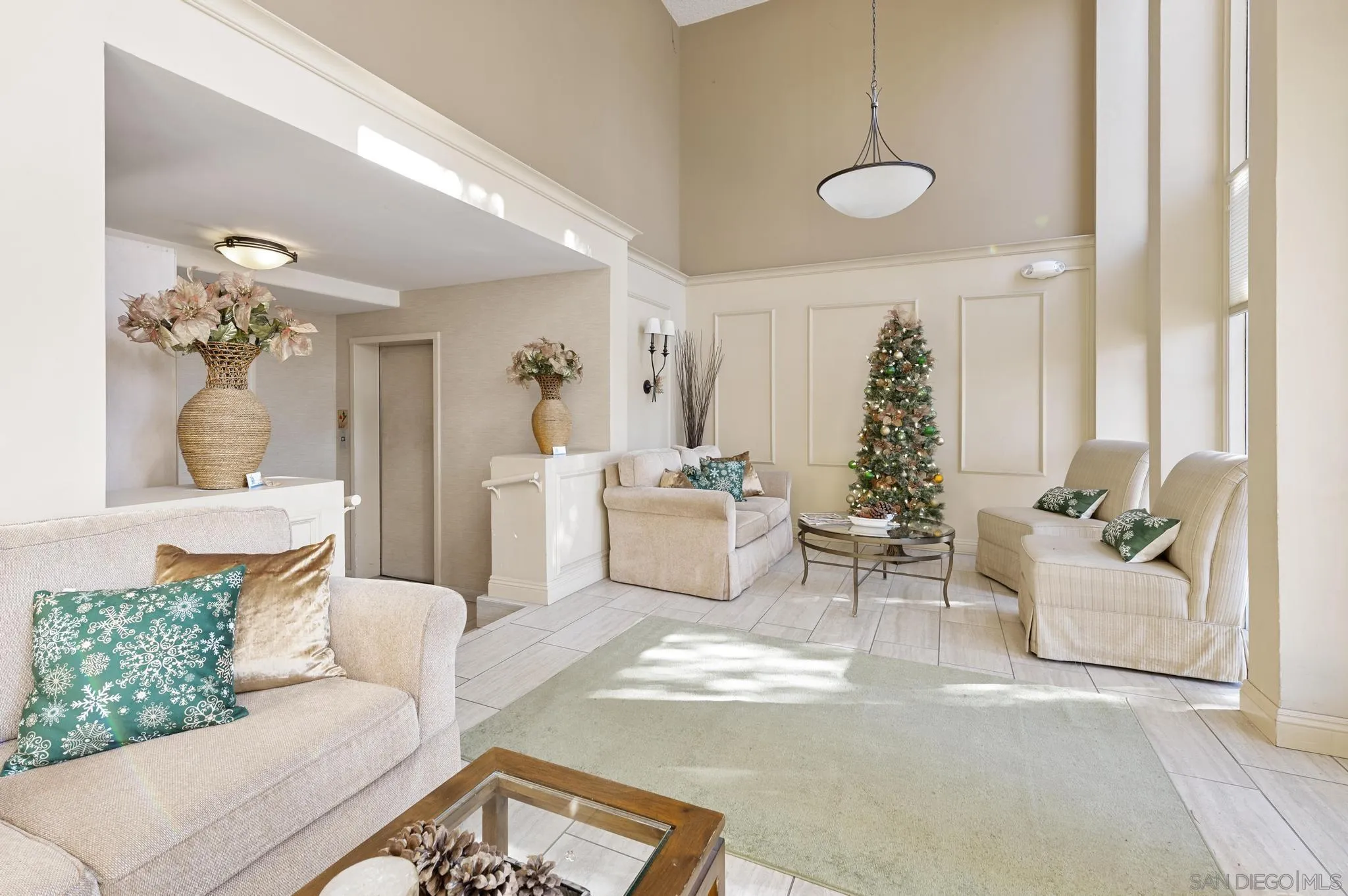140 Walnut Avenue, Unit 2A San Diego, CA 92103 - Photo 19 of 22 a living room with furniture and a chandelier