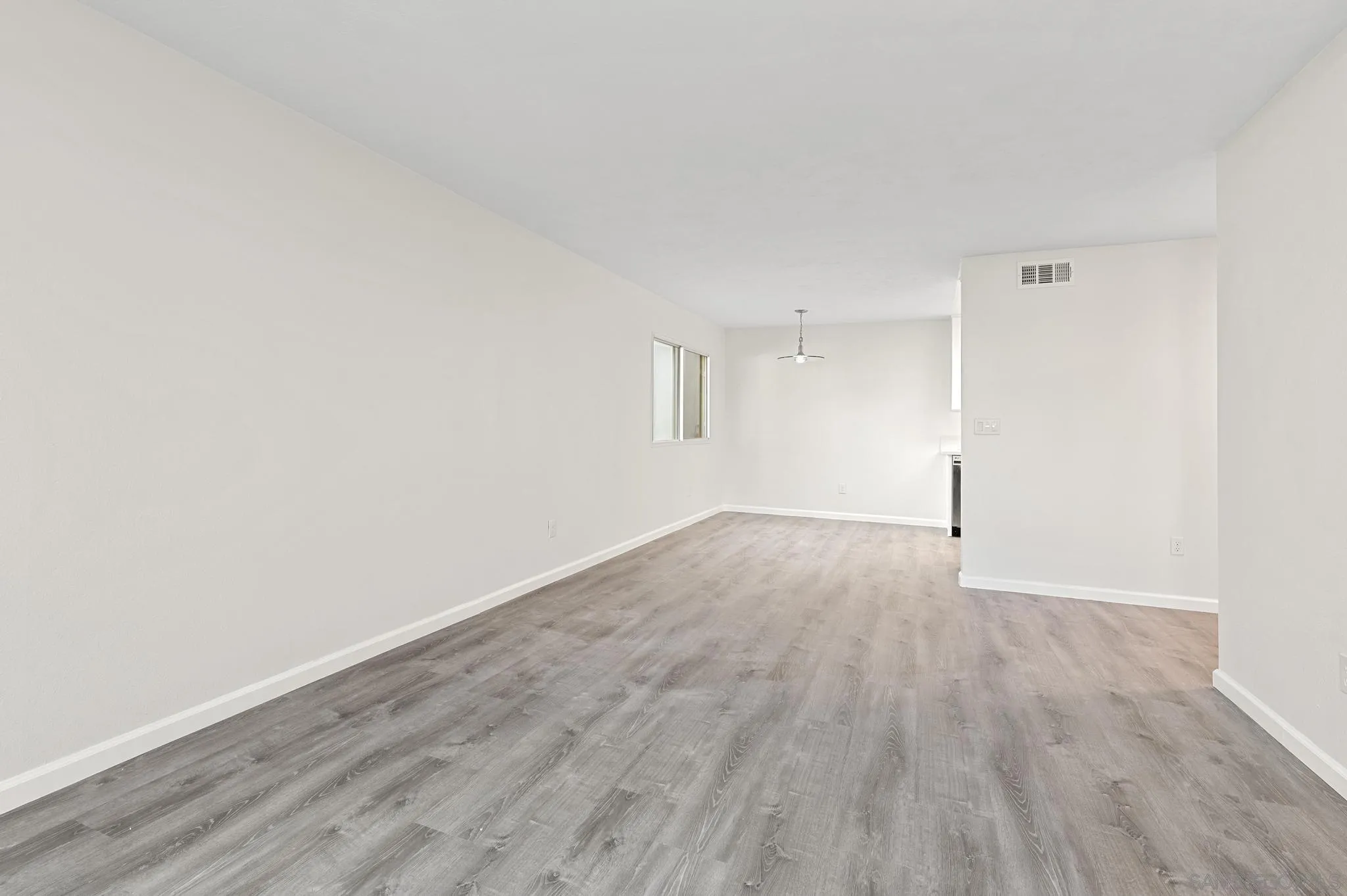 140 Walnut Avenue, Unit 2A San Diego, CA 92103 - Photo 3 of 22 an empty room with wooden floor