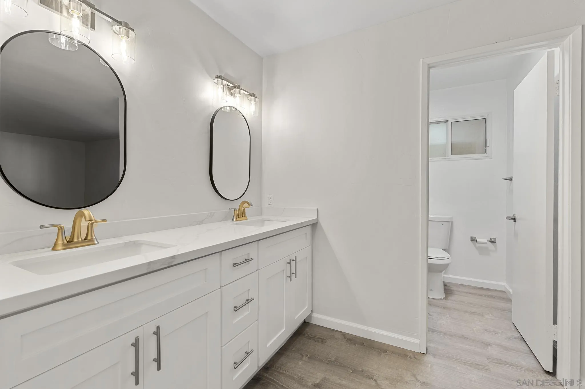 140 Walnut Avenue, Unit 2A San Diego, CA 92103 - Photo 10 of 22 a bathroom with 2 sink and a mirror