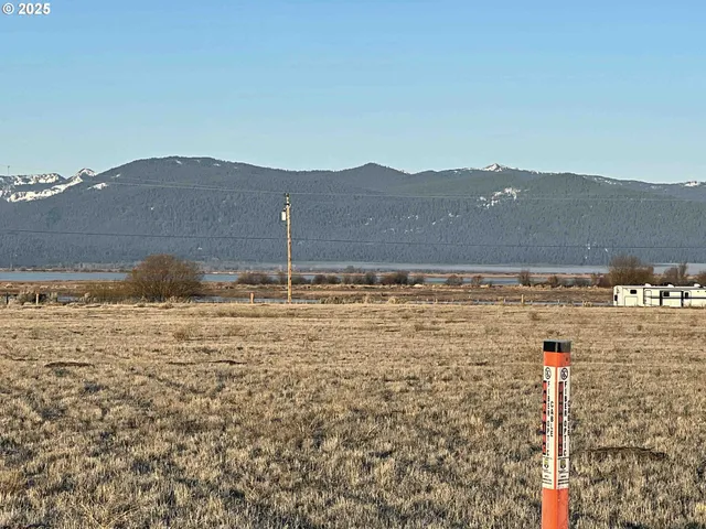 a view of lake with mountain in background