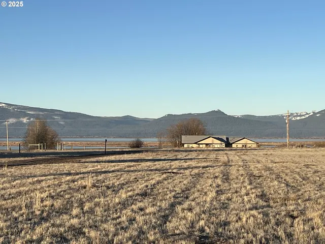 a view of a large body of water with a mountain in the background