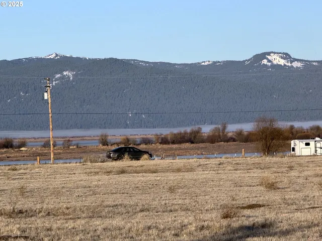 a view of a town with mountains