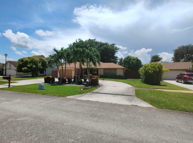 a view of street with houses in background