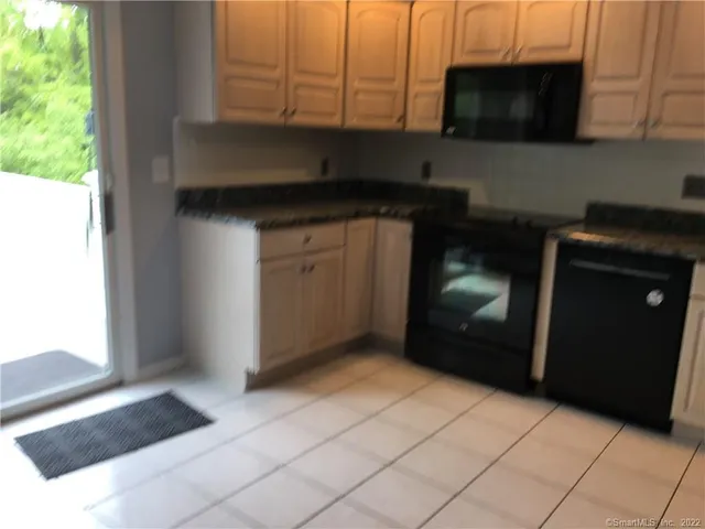 a kitchen with a sink and a microwave