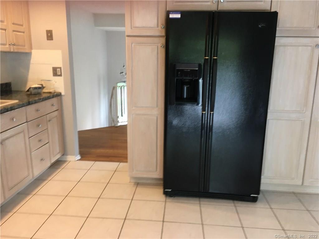 17 Cottontail Road Norwalk, CT 06854 - Photo 7 of 10 a view of a refrigerator in kitchen and an empty room