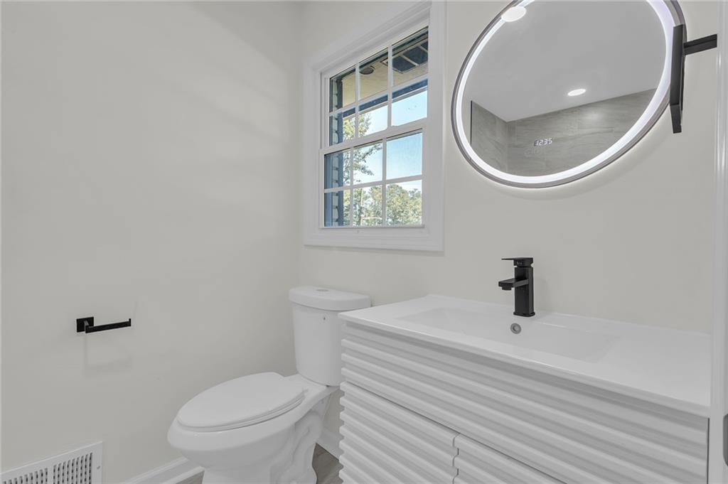 2401 Winshire Drive Decatur, GA 30035 - Photo 11 of 35 a bathroom with a sink and a mirror