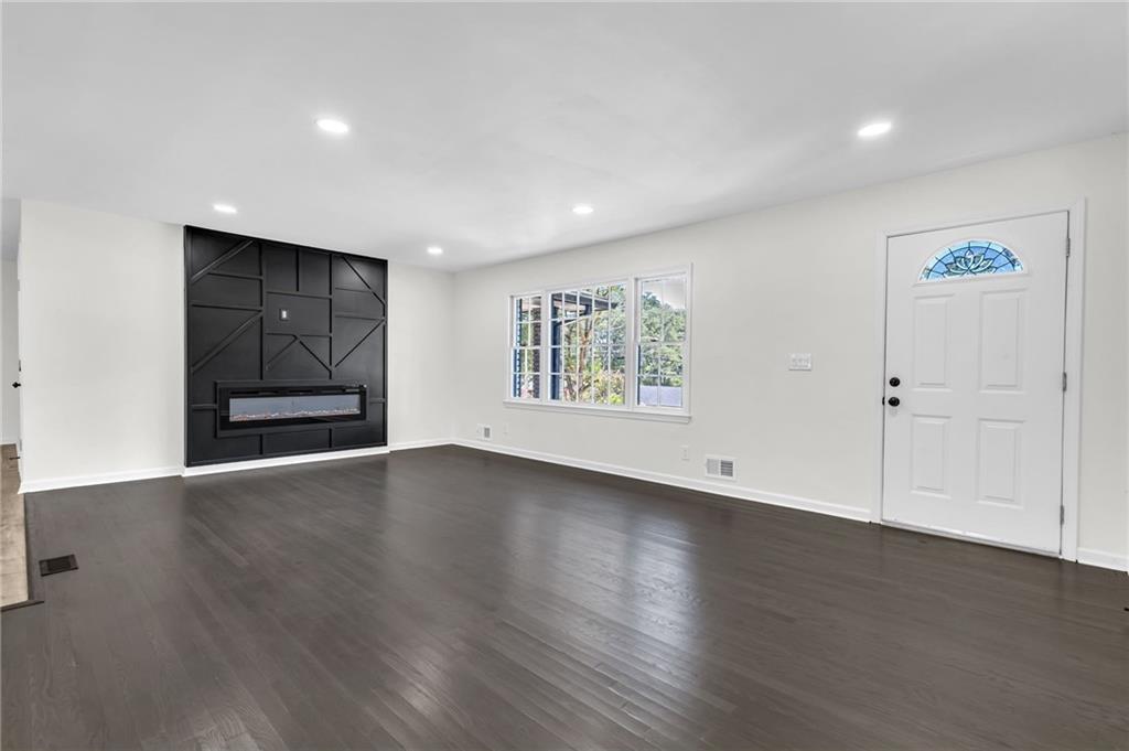 2401 Winshire Drive Decatur, GA 30035 - Photo 19 of 35 an empty room with wooden floor and window