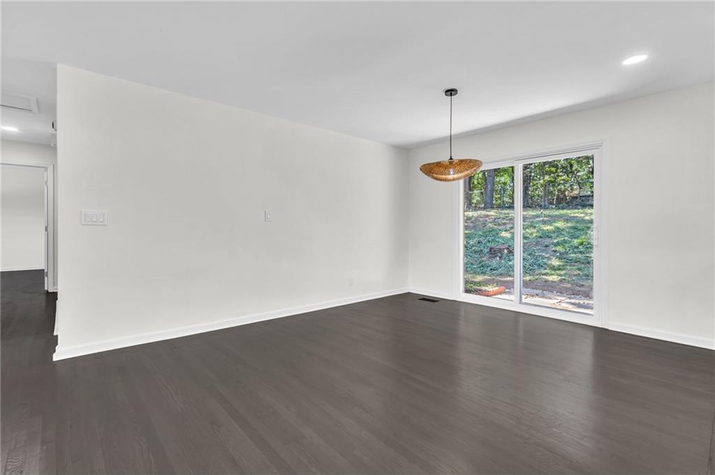 2401 Winshire Drive Decatur, GA 30035 - Photo 21 of 35 an empty room with wooden floor and outdoor view