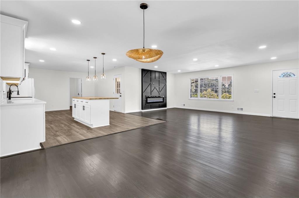 2401 Winshire Drive Decatur, GA 30035 - Photo 23 of 35 a view of a room with wooden floor and kitchen view