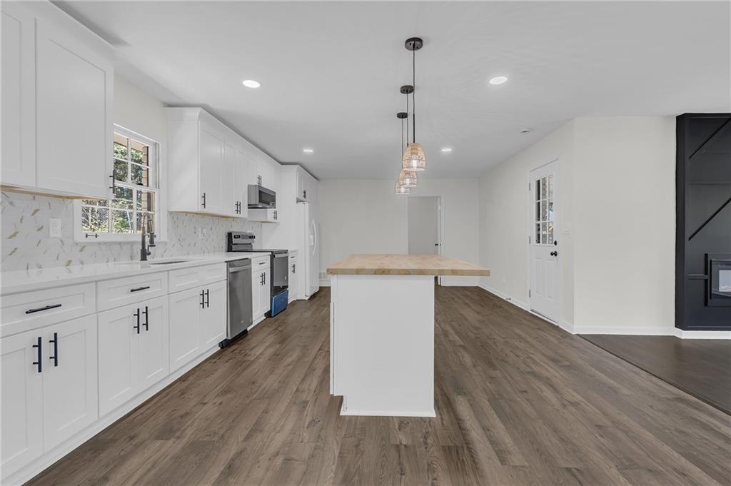 2401 Winshire Drive Decatur, GA 30035 - Photo 29 of 35 a large kitchen with a lot of counter space and stainless steel appliances