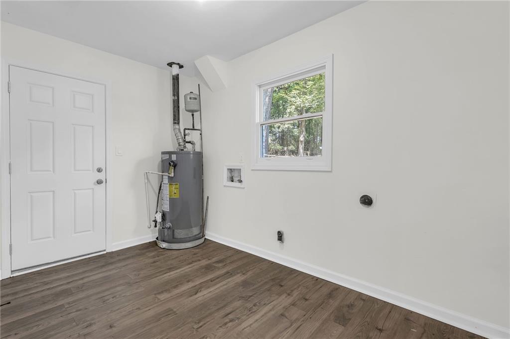 2401 Winshire Drive Decatur, GA 30035 - Photo 33 of 35 an empty room with wooden floor and windows