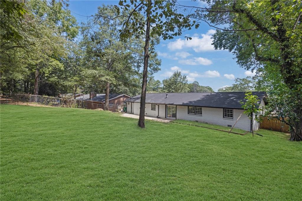 2401 Winshire Drive Decatur, GA 30035 - Photo 34 of 35 a view of a house with a yard and a large tree