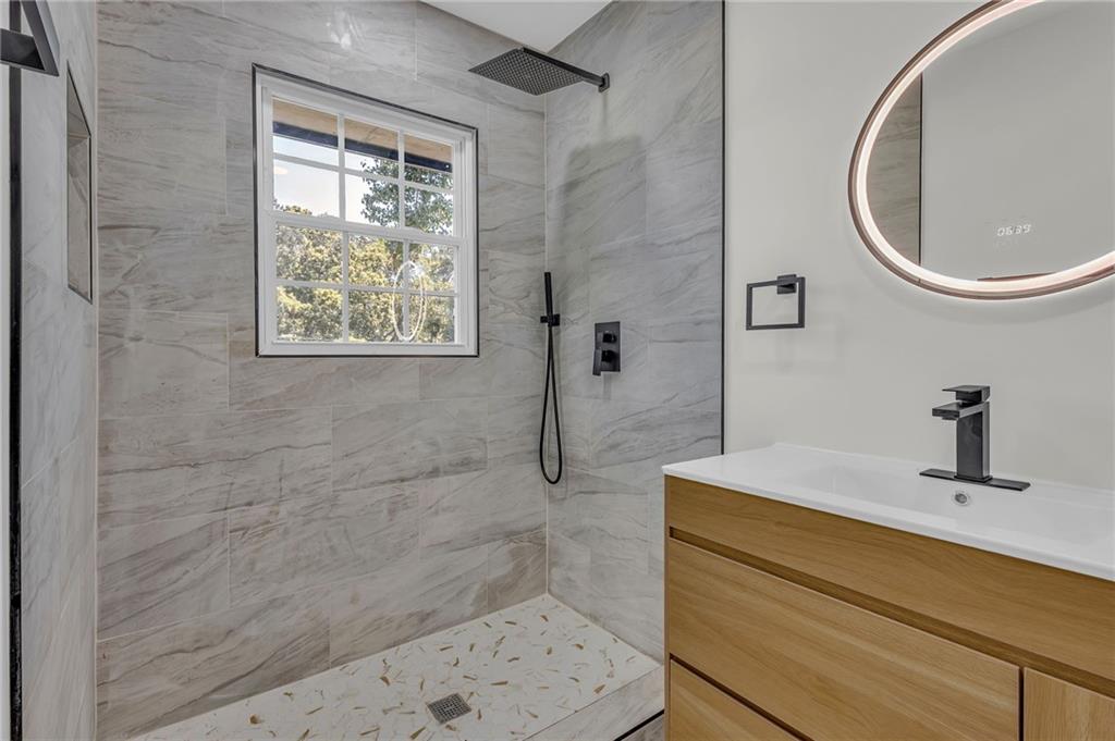 2401 Winshire Drive Decatur, GA 30035 - Photo 6 of 35 a bathroom with a sink a toilet and shower