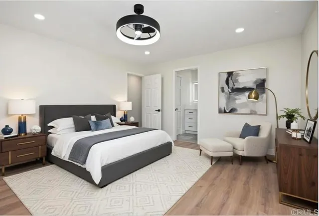 a spacious bedroom with a bed and a couch