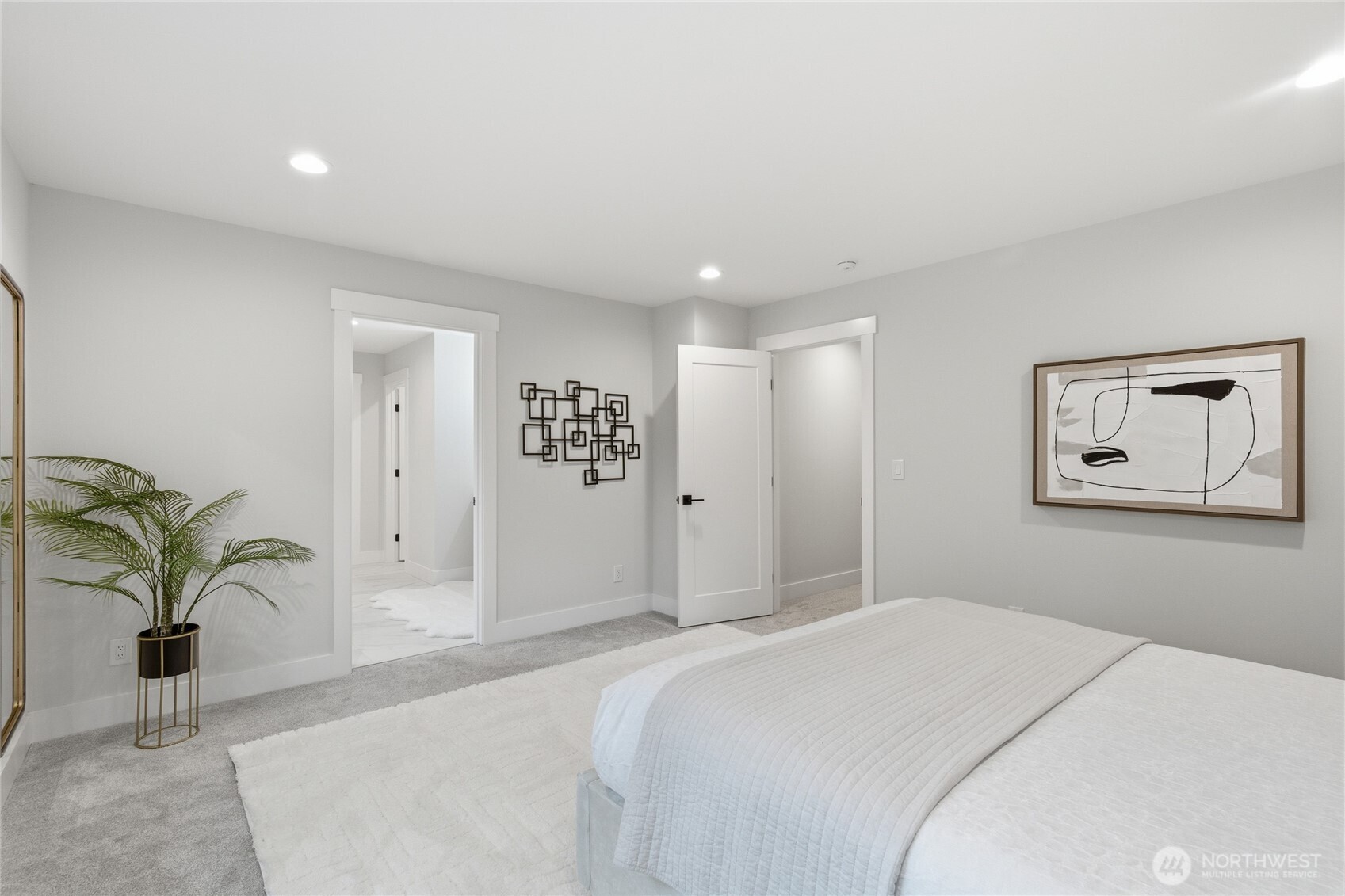719 Edmonds Way Edmonds, WA 98020 - Photo 19 of 40 a bedroom with a balcony a bed and a painting on the wall