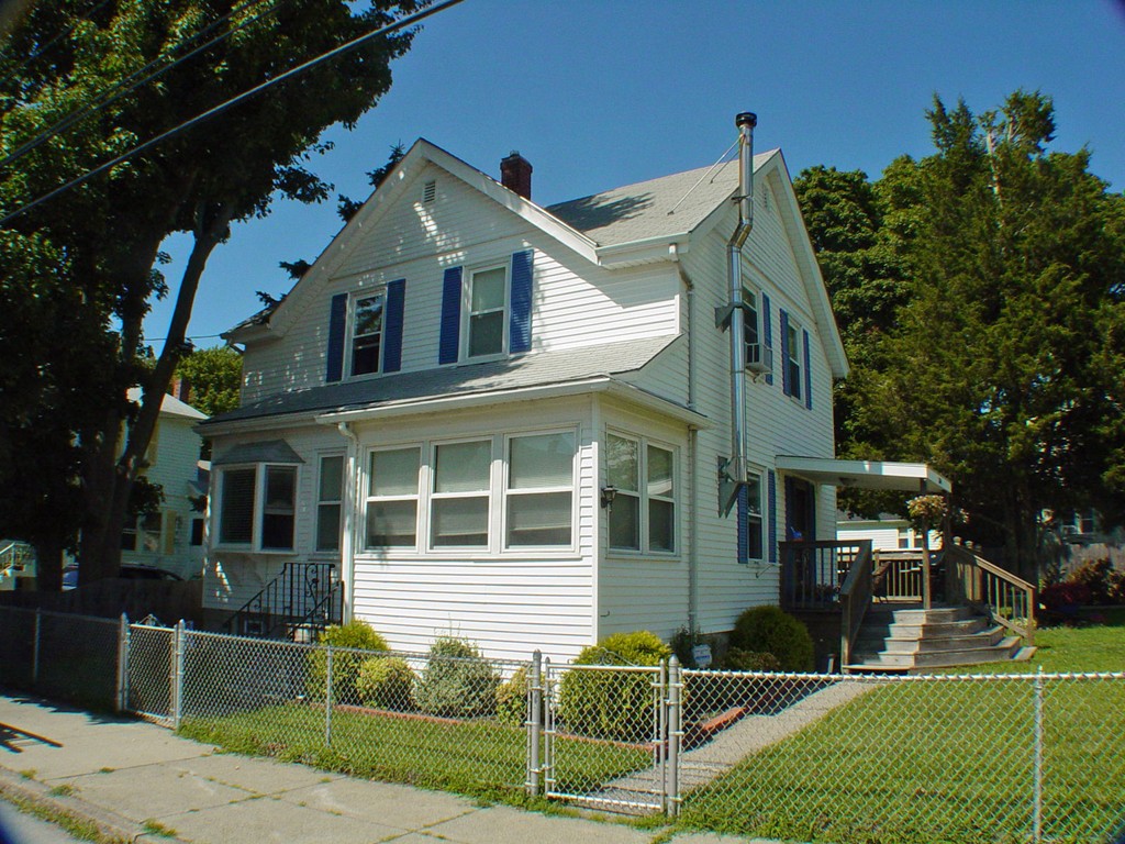 384 Anthony Street Fall River, MA 02721 - Photo 1 of 26 a front view of a house with a yard