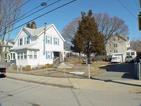 384 Anthony Street Fall River, MA 02721 - Photo 4 of 26 a view of a white house with a street
