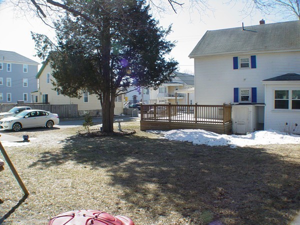 384 Anthony Street Fall River, MA 02721 - Photo 7 of 26 a front view of a house with a yard