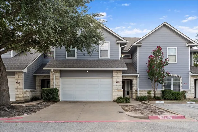 a front view of a house with a garage