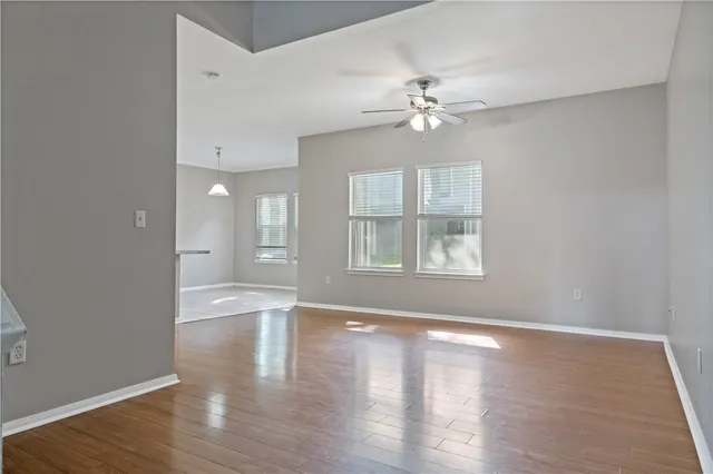 a view of a kitchen with wooden floor and a kitchen