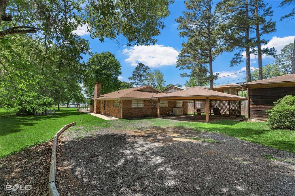 225 Marie Road Ringgold, LA 71068 - Photo 9 of 40 Brick exterior residence with an attached covered carport