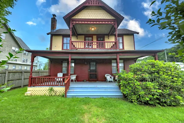 a view of a house with a small yard