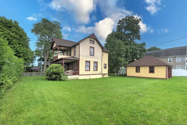 a front view of a house with a garden and porch