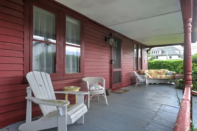 a view of a two chairs in the balcony