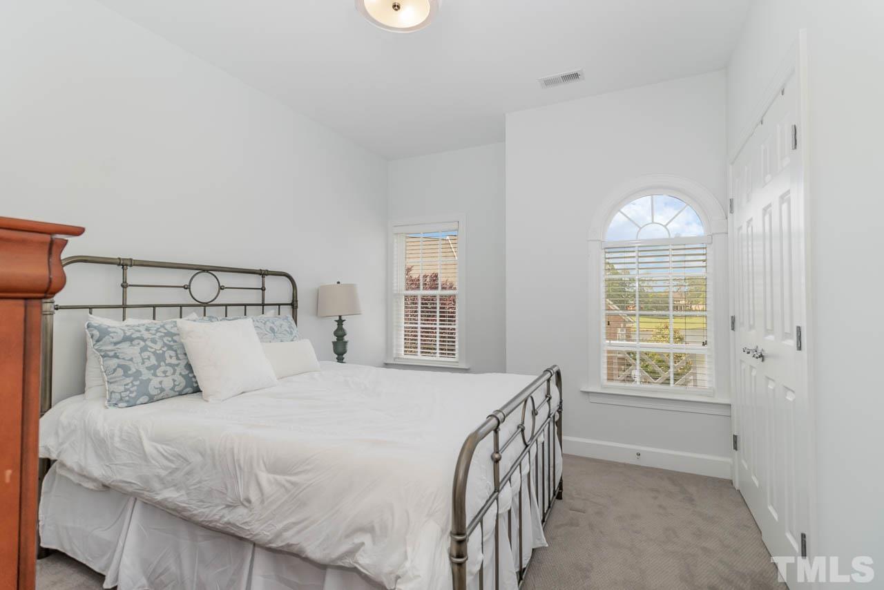 12507 Megan Hill Court Raleigh, NC 27614 - Photo 21 of 39 a bedroom with a bed and a window