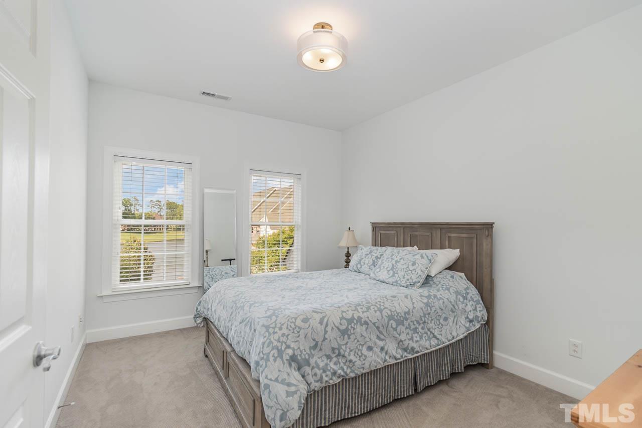 12507 Megan Hill Court Raleigh, NC 27614 - Photo 22 of 39 a bedroom with a bed and window