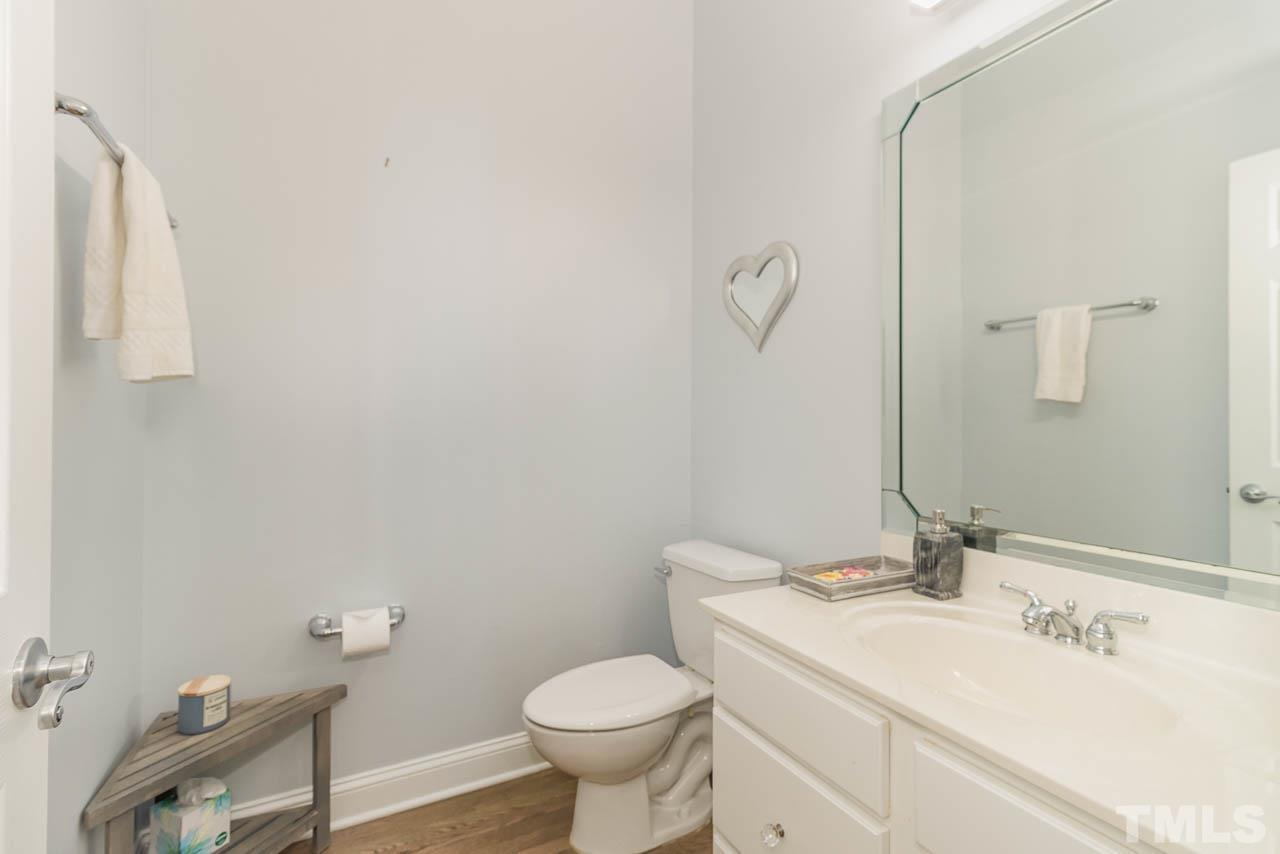 12507 Megan Hill Court Raleigh, NC 27614 - Photo 26 of 39 a bathroom with a sink a toilet and a mirror