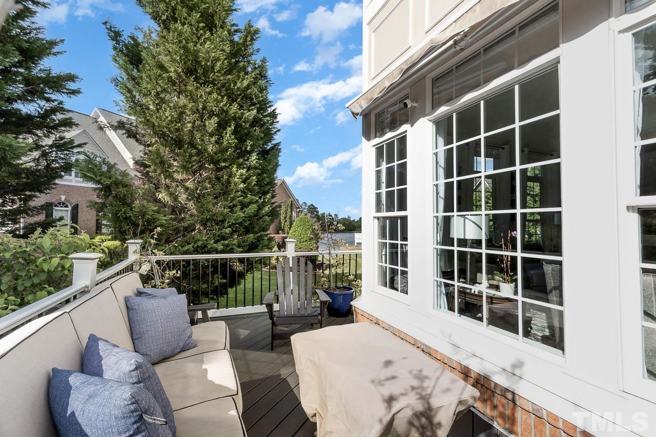 12507 Megan Hill Court Raleigh, NC 27614 - Photo 27 of 39 a view of balcony with two chairs and a window