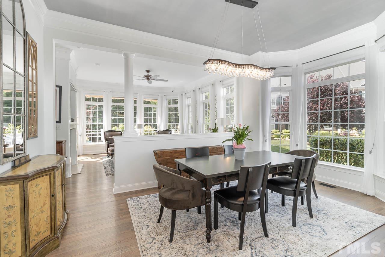 12507 Megan Hill Court Raleigh, NC 27614 - Photo 3 of 39 a view of a dining room with furniture window and wooden floor