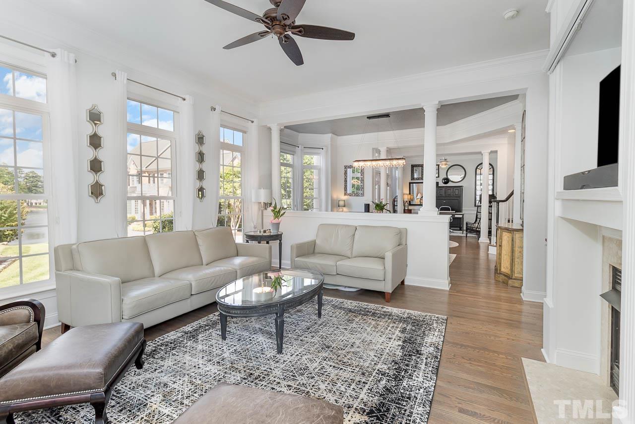 12507 Megan Hill Court Raleigh, NC 27614 - Photo 6 of 39 a living room with furniture and a large window