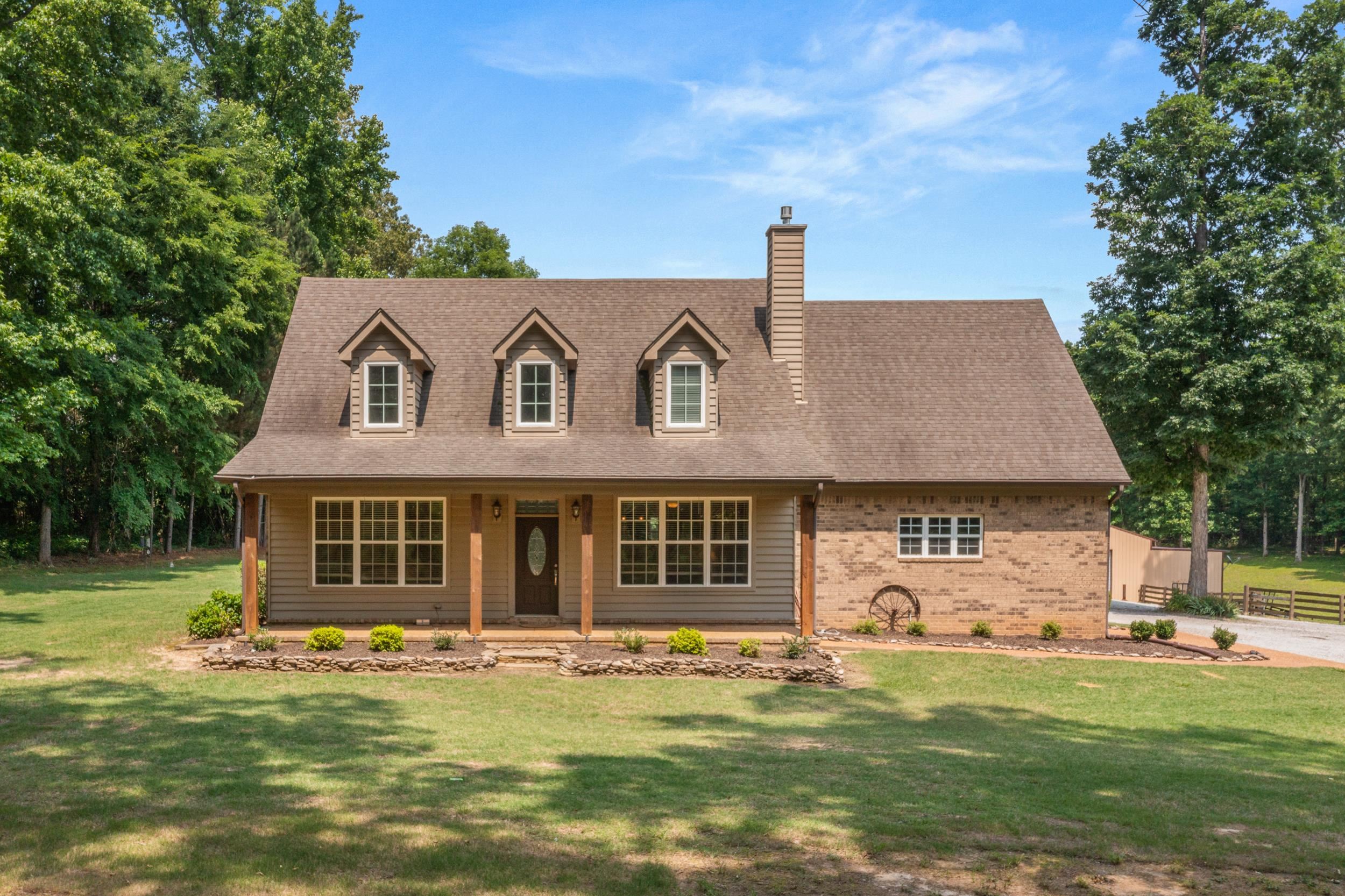 6415 Lagrange Road Somerville, TN 38068 - Photo 12 of 32 New england style home featuring a chimney, a porch, brick siding, a front yard, and roof with shingles