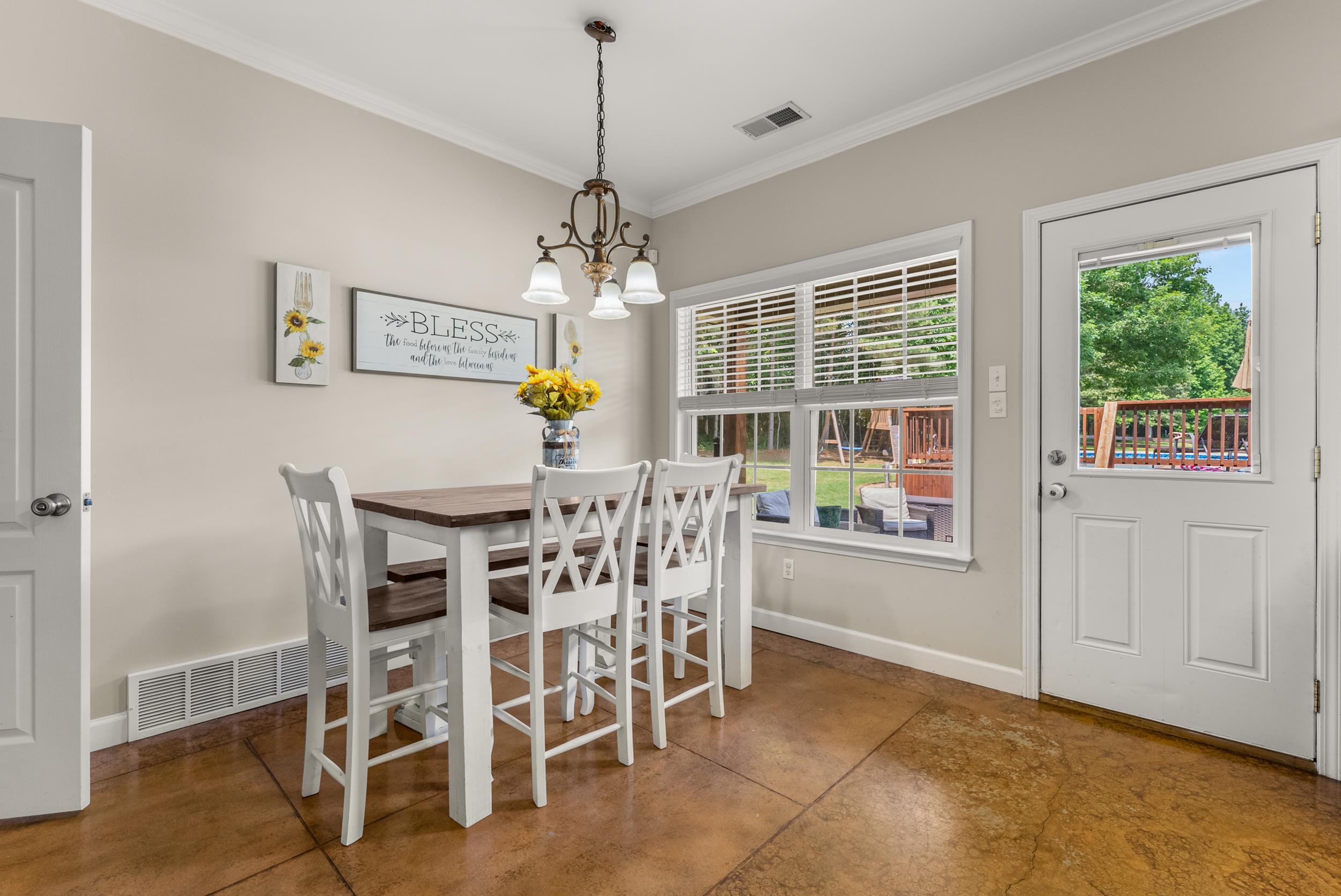 6415 Lagrange Road Somerville, TN 38068 - Photo 16 of 32 Dining area with a chandelier, ornamental molding, and baseboards