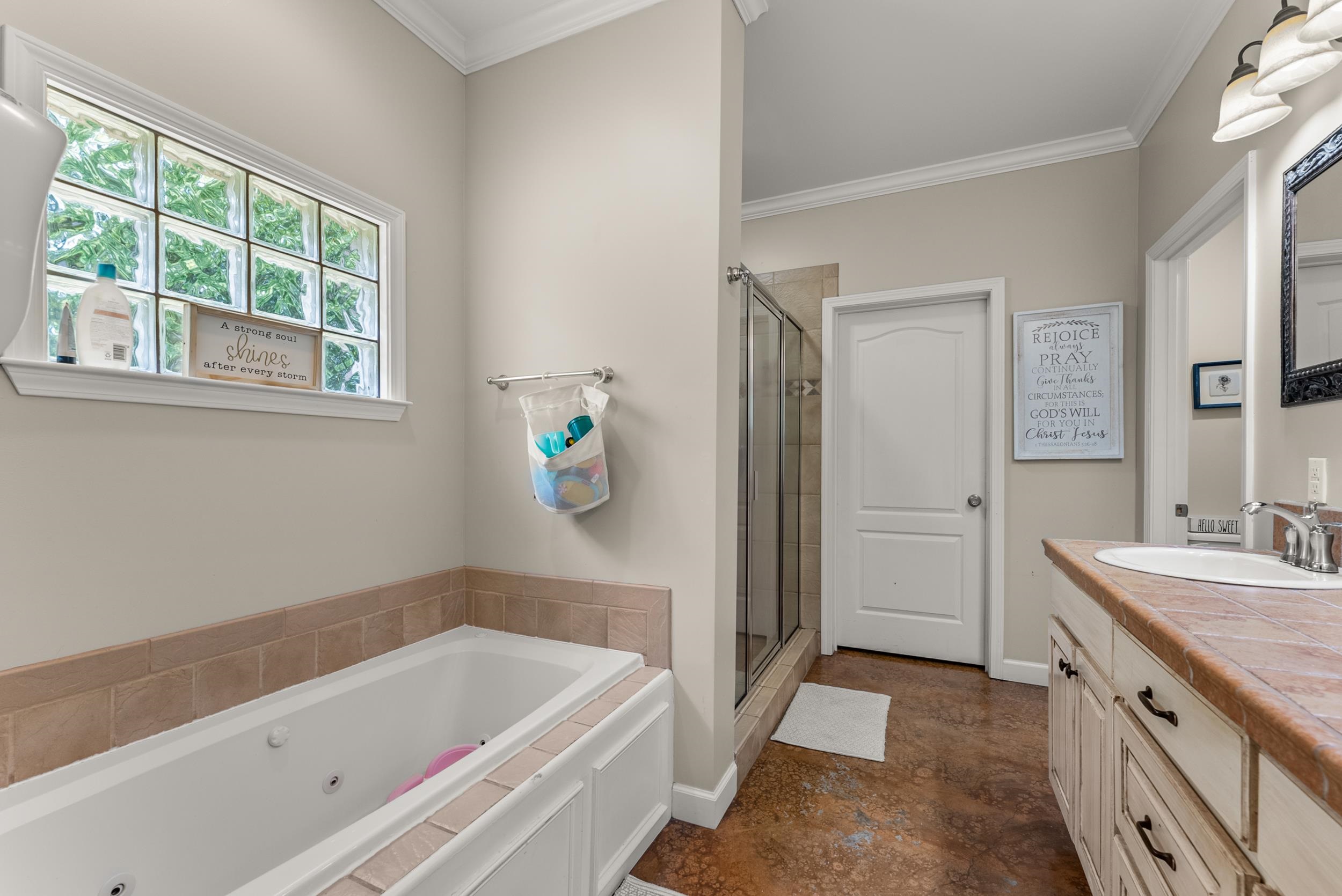 6415 Lagrange Road Somerville, TN 38068 - Photo 24 of 32 Bathroom featuring a stall shower, a whirlpool tub, vanity, ornamental molding, and baseboards