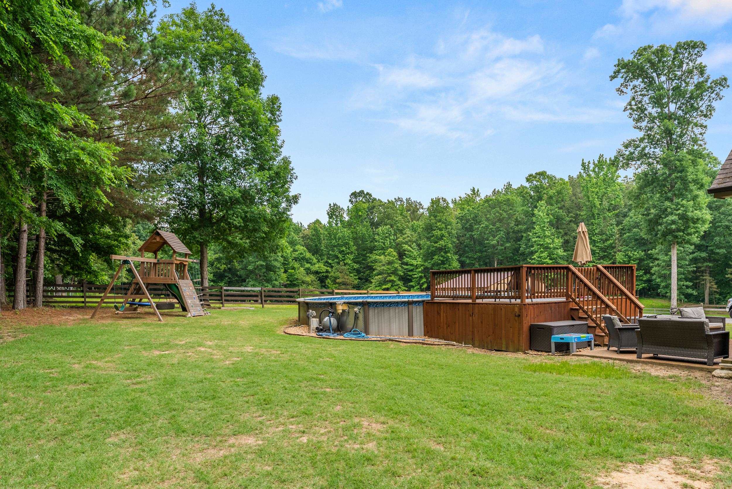 6415 Lagrange Road Somerville, TN 38068 - Photo 4 of 32 View of yard with a playground, outdoor lounge area, an outdoor pool, and a patio