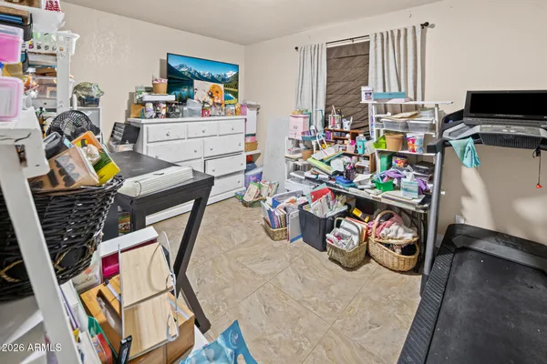 a bedroom with a bed and a cabinets