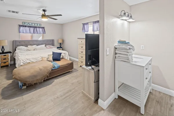 a storage room with furniture and a flat screen tv
