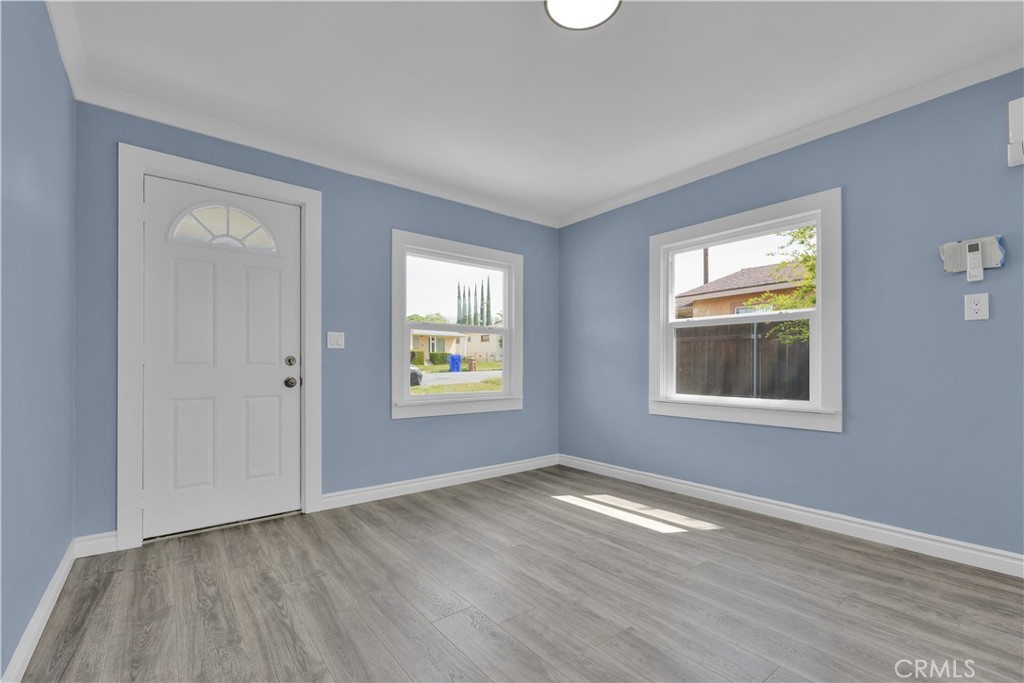 34945 Ave B Yucaipa, CA 92399 - Photo 20 of 69 a view of an empty room with wooden floor and a window