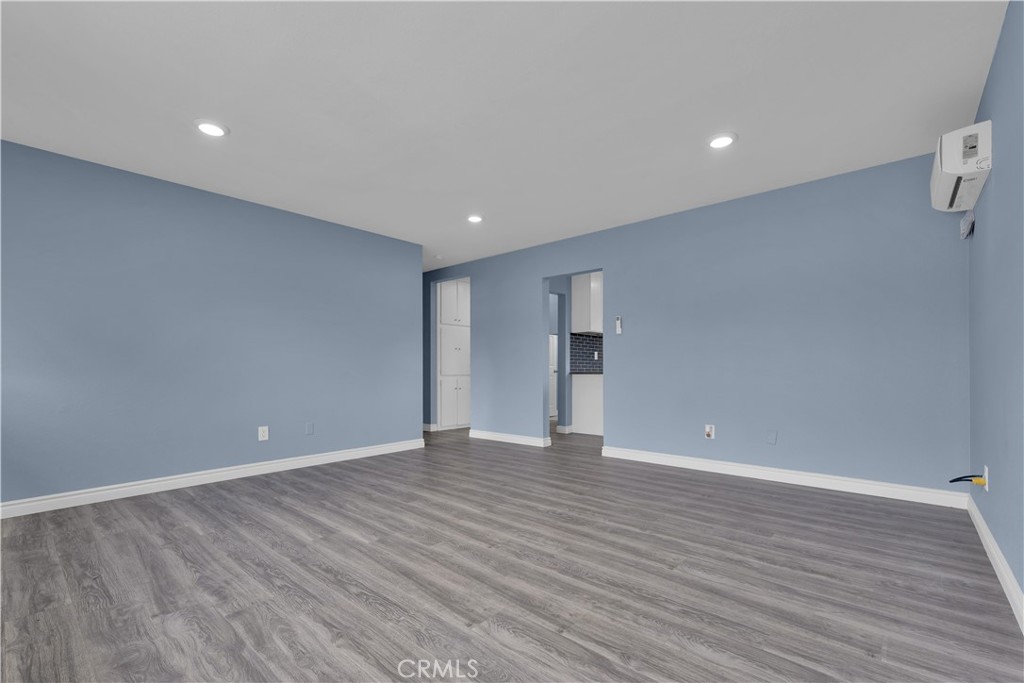 34945 Ave B Yucaipa, CA 92399 - Photo 32 of 69 a view of an empty room with wooden floor
