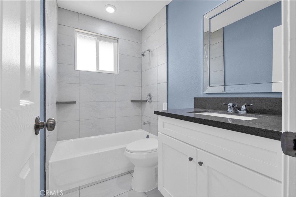34945 Ave B Yucaipa, CA 92399 - Photo 43 of 69 a bathroom with a sink a toilet and bathtub