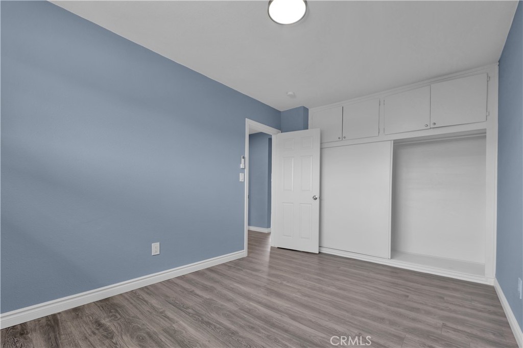 34945 Ave B Yucaipa, CA 92399 - Photo 47 of 69 a view of an empty room with wooden floor