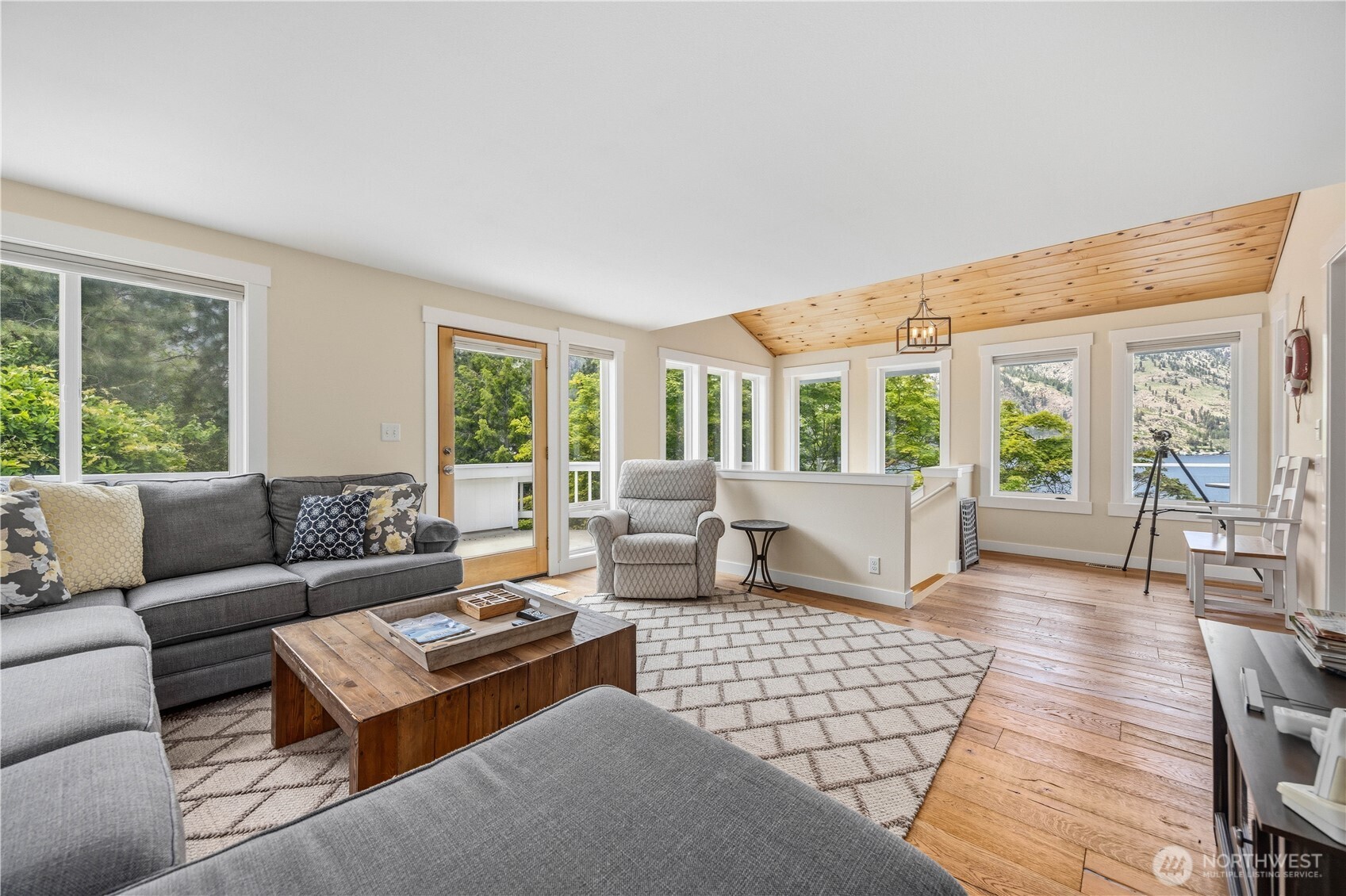 141 Sunset Place Manson, WA 98831 - Photo 8 of 38 a living room with furniture and large windows