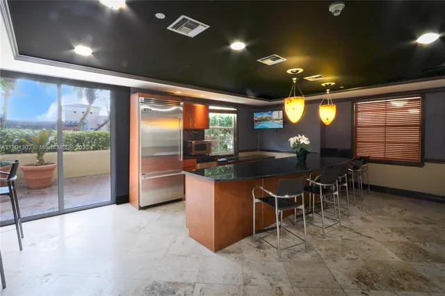 a living room with a book shelf and a book shelf