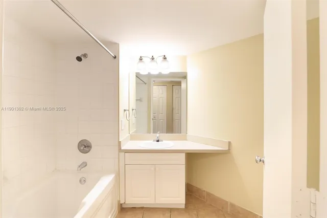 a view of a bathroom with a glass shower door
